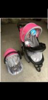 COCHE CON BABYSEAT FUCSIA/GRIS  ( ENC )